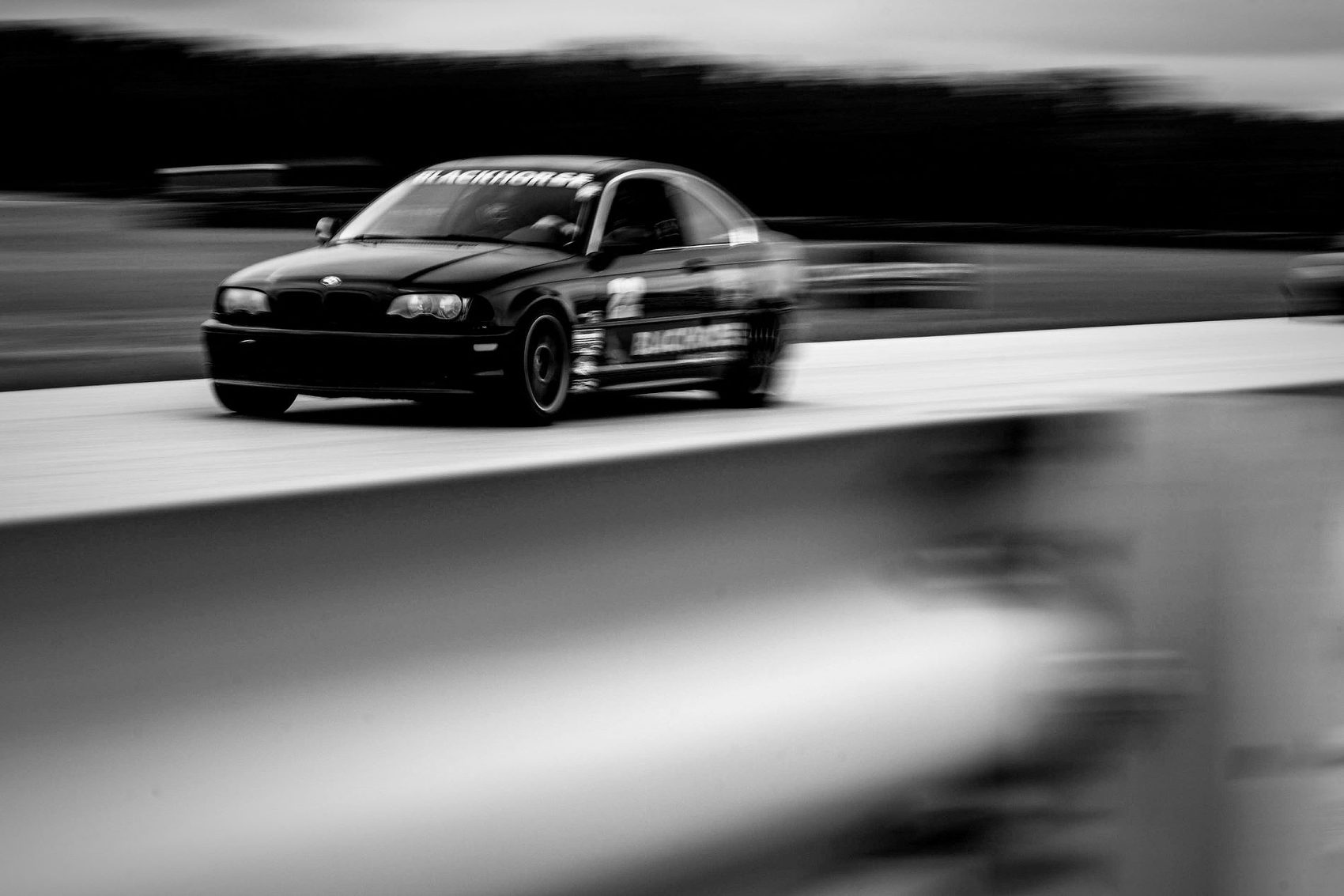 Blackhorse Automotive race car at speed on track
